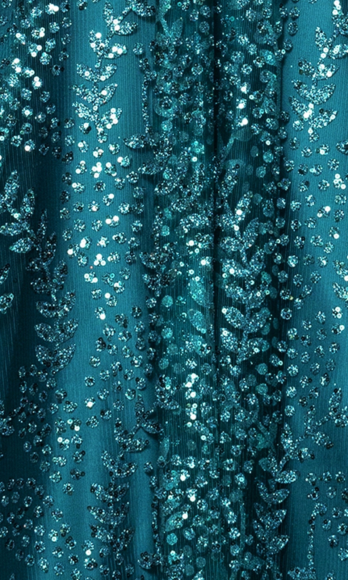 Close-up of teal sequin and embroidered leaf fabric, ideal for a corset bodice or adding shimmer to the Long Glitter Prom Dress: Blondie Nites 4617BN.